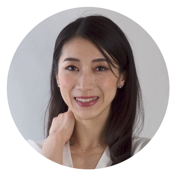 Woman with long dark hair smiling